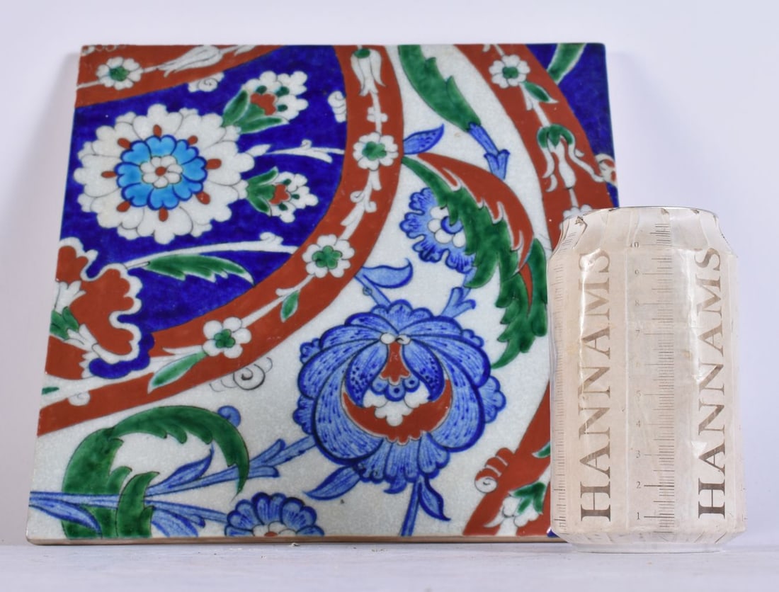 A TURKISH OTTOMAN POTTERY TILE. 25.5 cm square. (1 of 5)