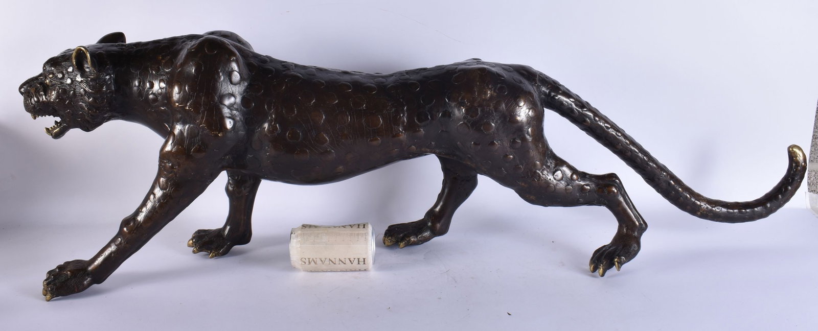 A LARGE BRONZE STUDY OF A LEOPARD. 105 cm x 38 cm. (1 of 6)