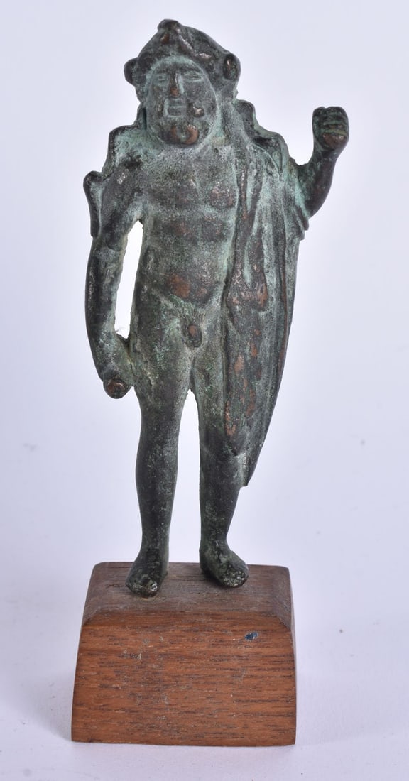 AN EARLY EUROPEAN BRONZE FIGURE OF A MALE possibly antiquity, modelled with one hand raised. Bronze (1 of 7)