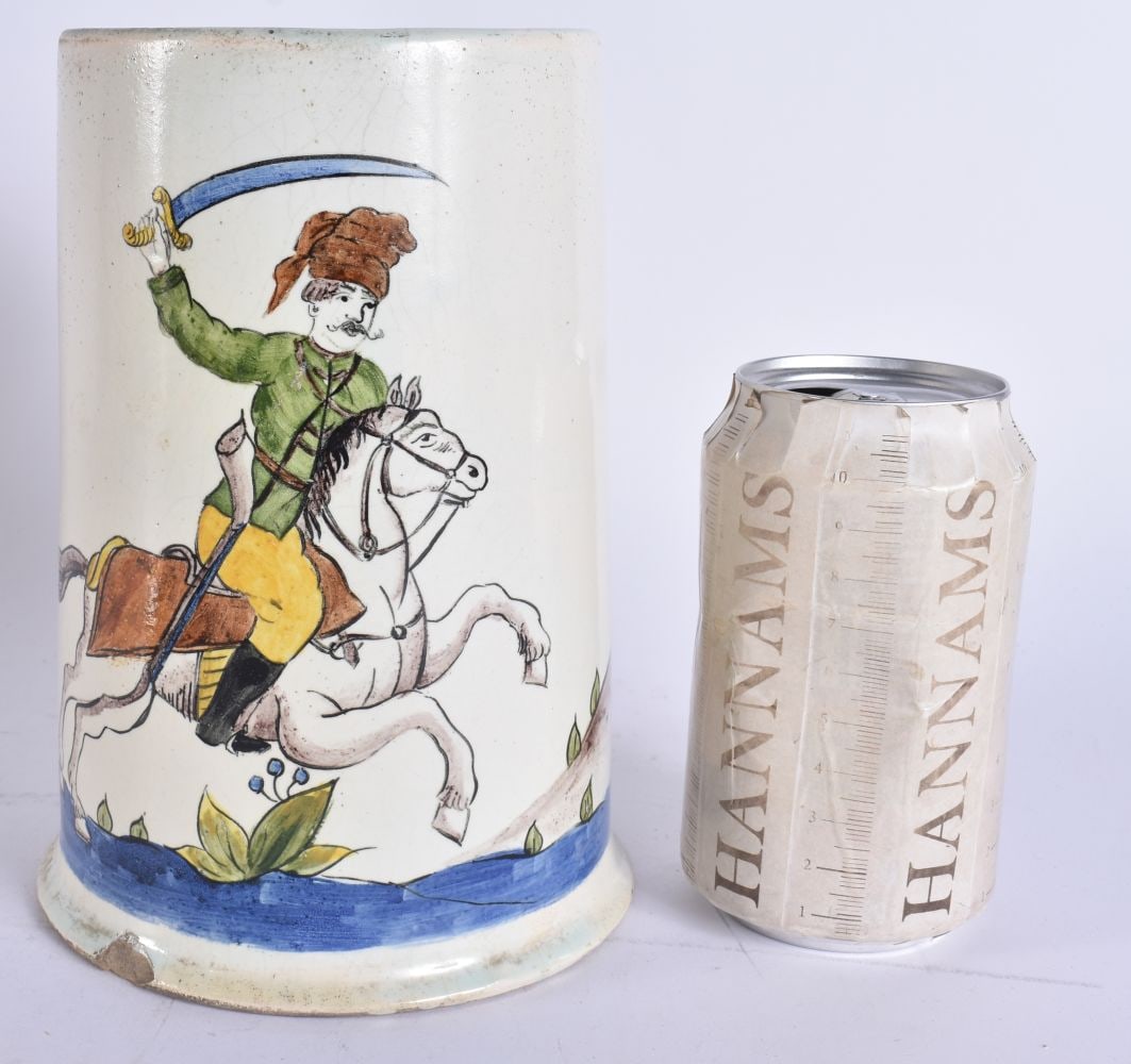 A RARE 18TH CENTURY CONTINENTAL FAIENCE POTTERY JUG painted with an Eastern male holding a sword. 18 (1 of 5)