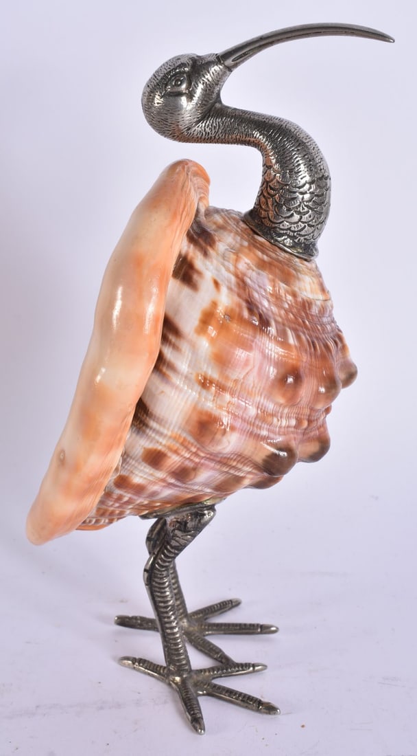 AN UNUSUAL EARLY 20TH CENTURY WHITE METAL CONCH SHELL FIGURE OF A BIRD. 23.5 cm high. (1 of 5)