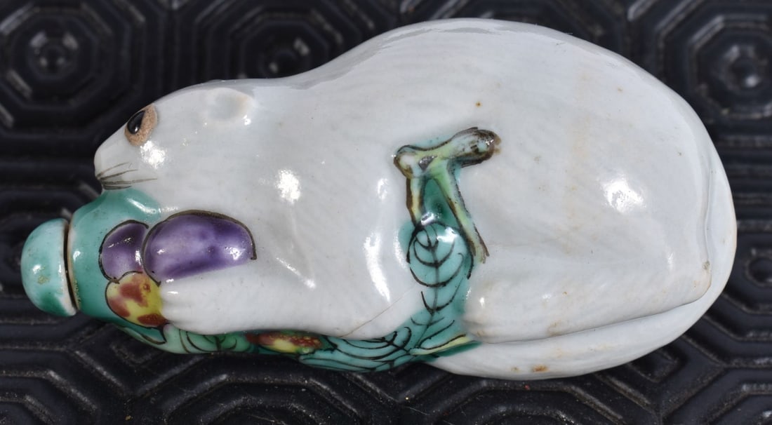 A RARE LATE 19TH CENTURY CHINESE PORCELAIN SNUFF BOTTLE formed as a squirrel upon vines. 7 cm wide. (1 of 5)