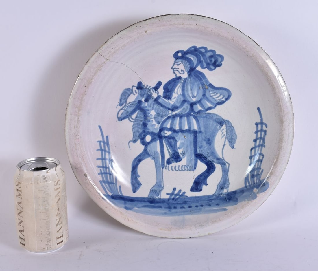 A LARGE 17TH/18TH CENTURY CONTINENTAL DELFT FAIENCE DISH painted with a figure on horseback. 30 cm w (1 of 4)
