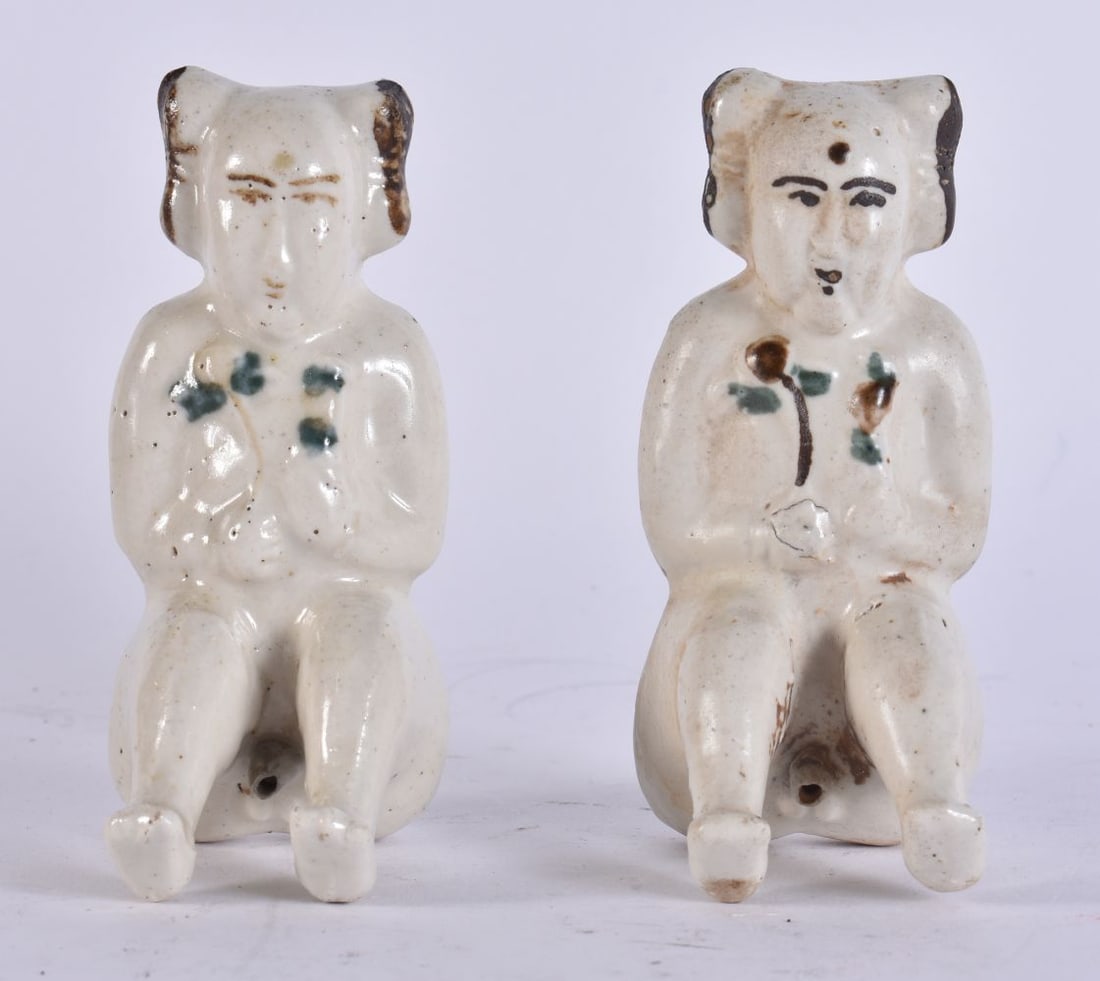 A PAIR OF CHINESE QING DYNASTY PORCELAIN FIGURES possibly shipwreck. 11 cm high. (1 of 4)