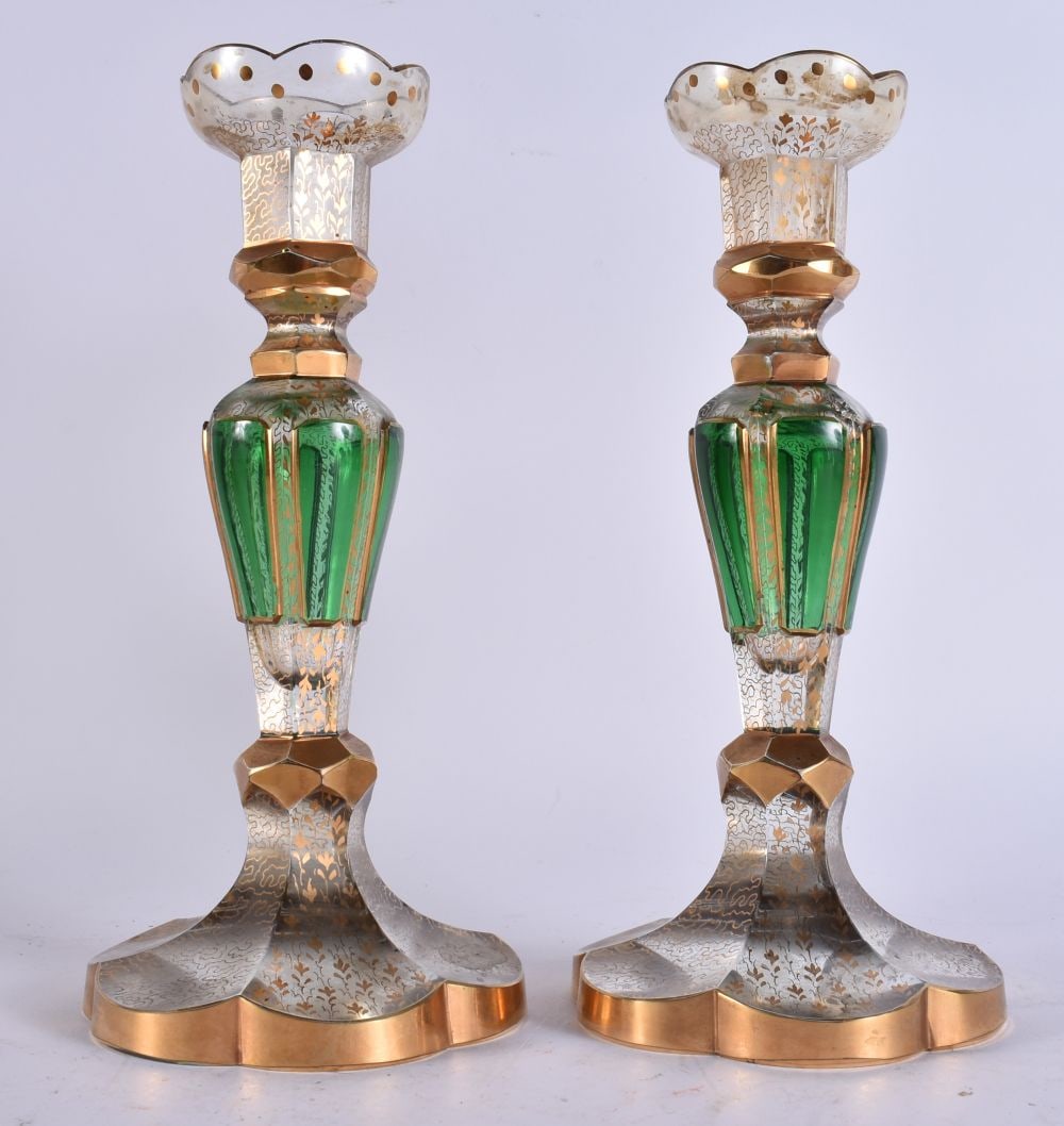 A PAIR OF 19TH CENTURY BOHEMIAN GREEN AND GILT GLASS CANDLESTICKS decorated with seaweed like motifs (1 of 4)