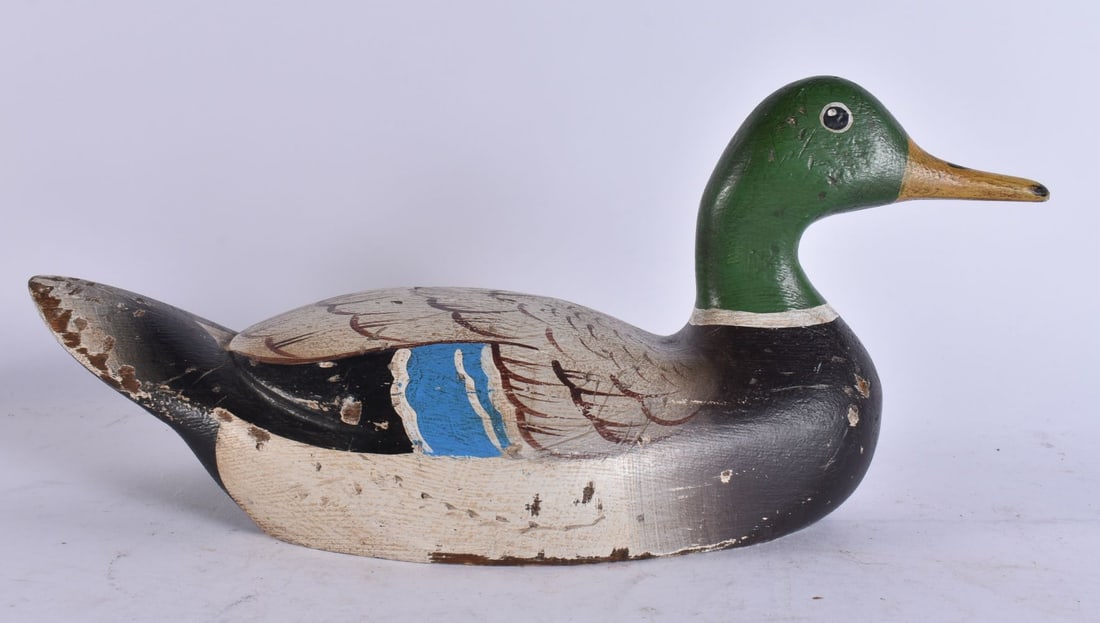 A FOLK ART CARVED WOOD DUCK DECOY. 32 cm wide. (1 of 3)