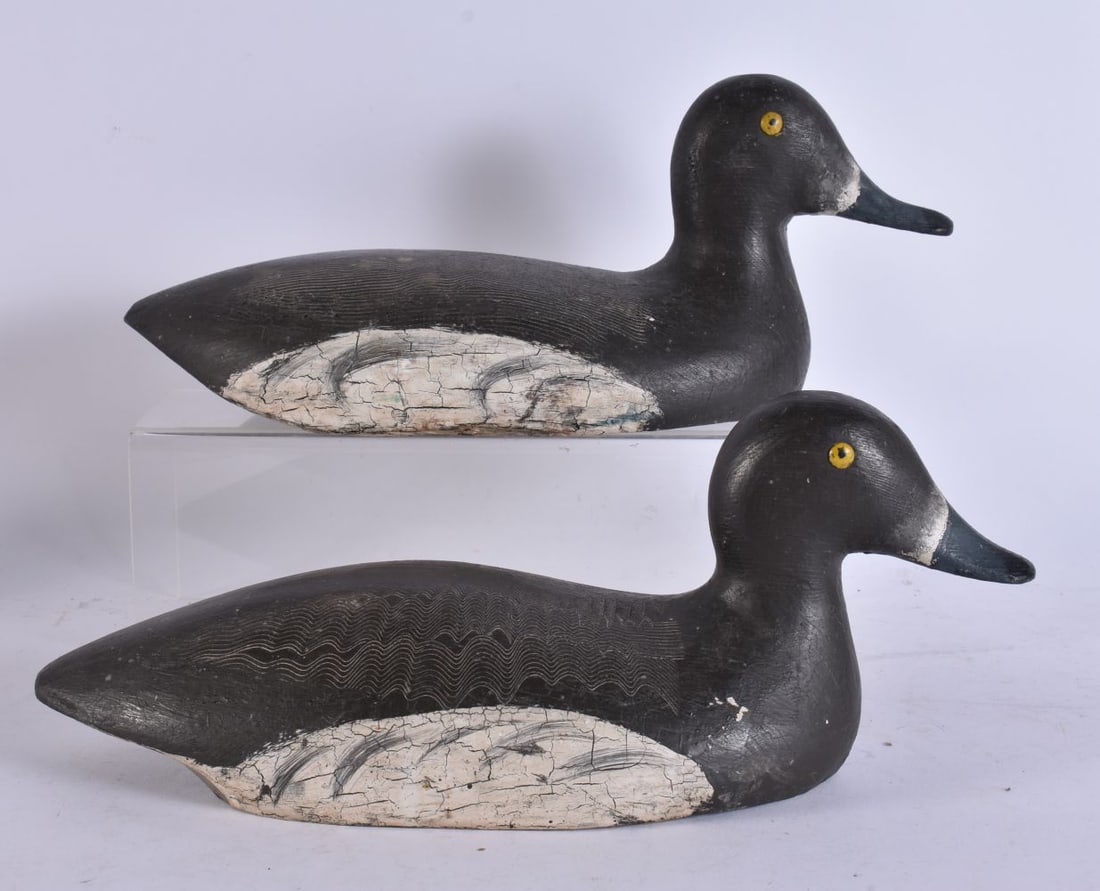 A PAIR OF FOLK ART CARVED WOOD DUCK DECOYS. 35 cm wide. (1 of 3)
