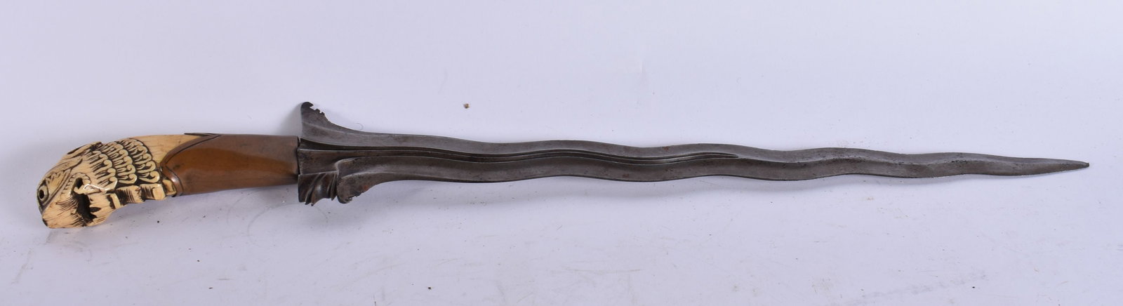 A FINE 18TH CENTURY SOUTH EAST ASIAN KRISS DAGGER with beautifully watered blade. 52 cm long. (1 of 4)