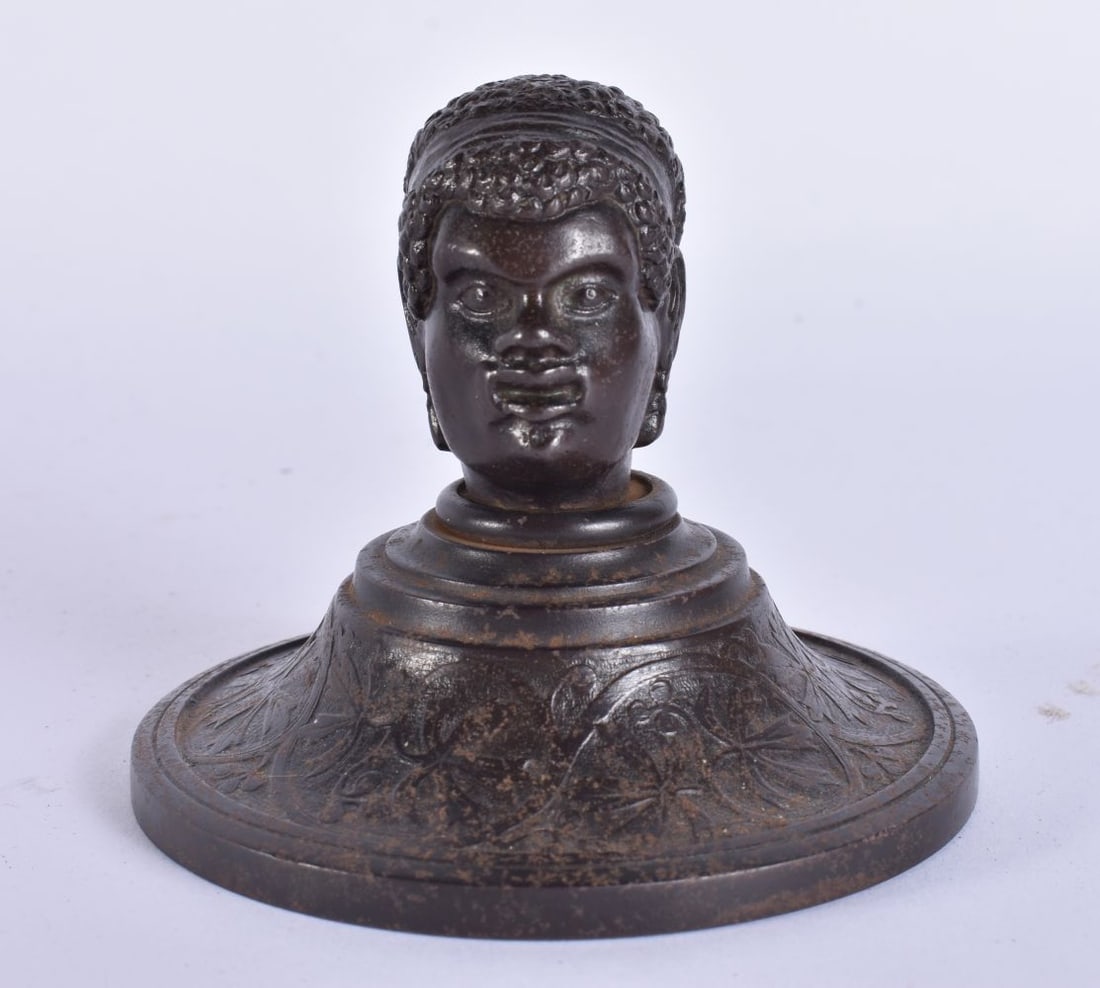 A GEORGE III CAST IRON NUBIAN HEAD DESK PAPERWEIGHT. 10.25 cm wide. (1 of 6)