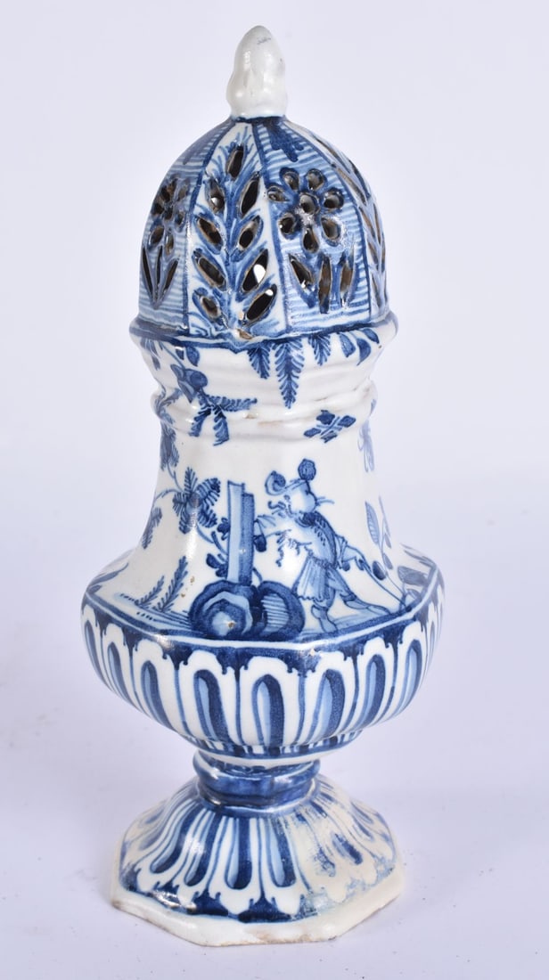 A RARE ANTIQUE DELFT BLUE AND WHITE SUGAR SIFTER painted with figures. 20.5 cm high. (1 of 4)