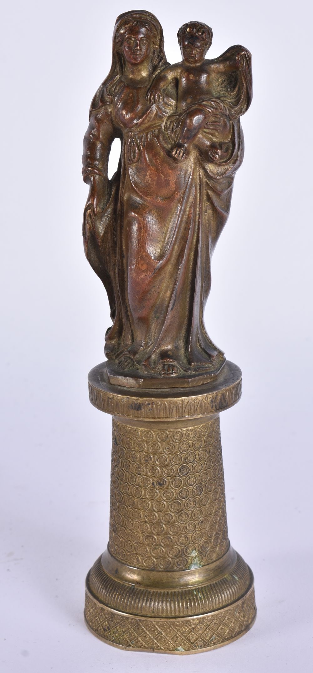 A 17TH/18TH CENTURY EUROPEAN BRONZE FIGURE OF A MADONNA AND CHILD modelled upon a finely engraved pe (1 of 11)
