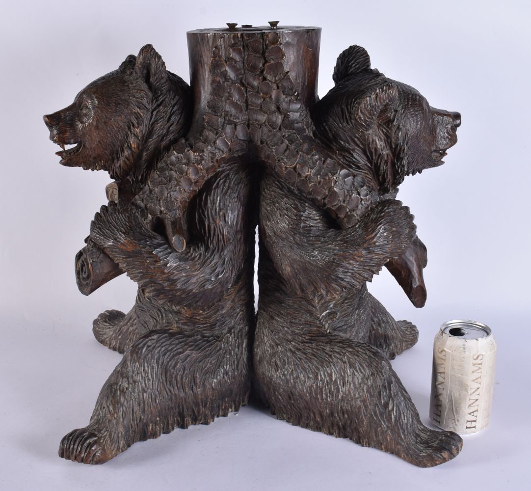 AN EXTREMELY RARE 19TH CENTURY BAVARIAN BLACK FOREST CARVED WOOD PIANO STOOL formed with two opposin (1 of 15)