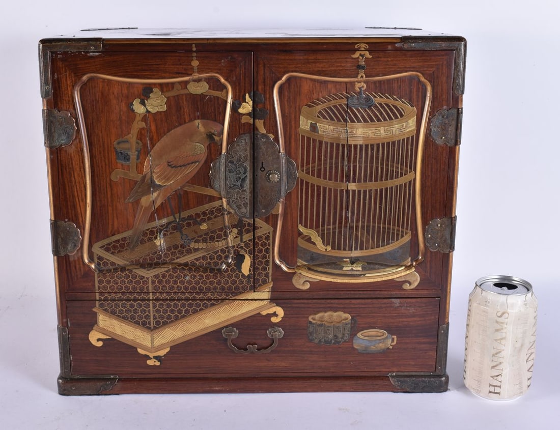 A FINE 19TH CENTURY JAPANESE MEIJI PERIOD GOLD AND SILVER LACQUER CABINET Ex Bonhams, decorated all: A FINE 19TH CENTURY JAPANESE MEIJI PERIOD GOLD AND SILVER LACQUER CABINET Ex Bonhams, decorated all over with hawks and bird cages, the drawers lacquered with character marks. 39 cm x 35 cm x 22 cm.