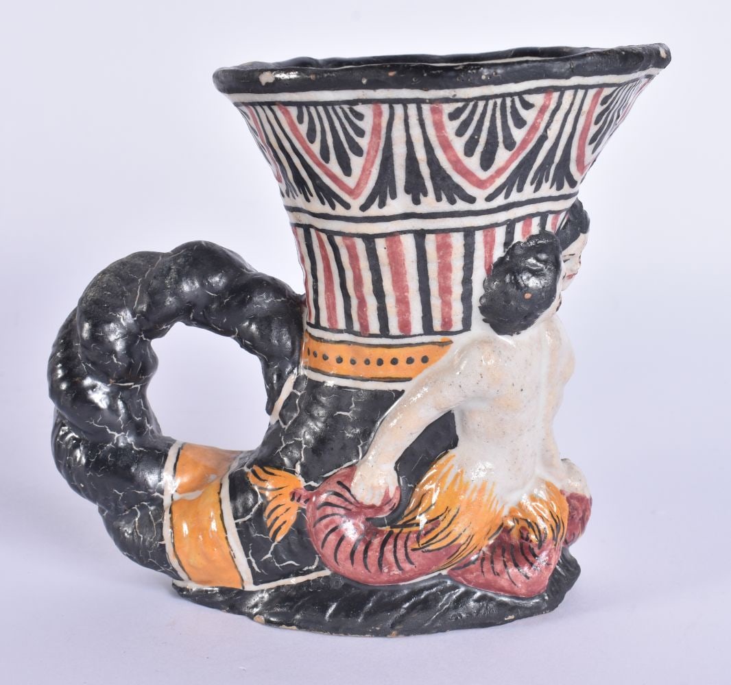 AN UNUSUAL ANTIQUE FAIENCE RHYTON POTTERY CUP After the Antiquity. 13 cm x 11 cm.: AN UNUSUAL ANTIQUE FAIENCE RHYTON POTTERY CUP After the Antiquity. 13 cm x 11 cm.