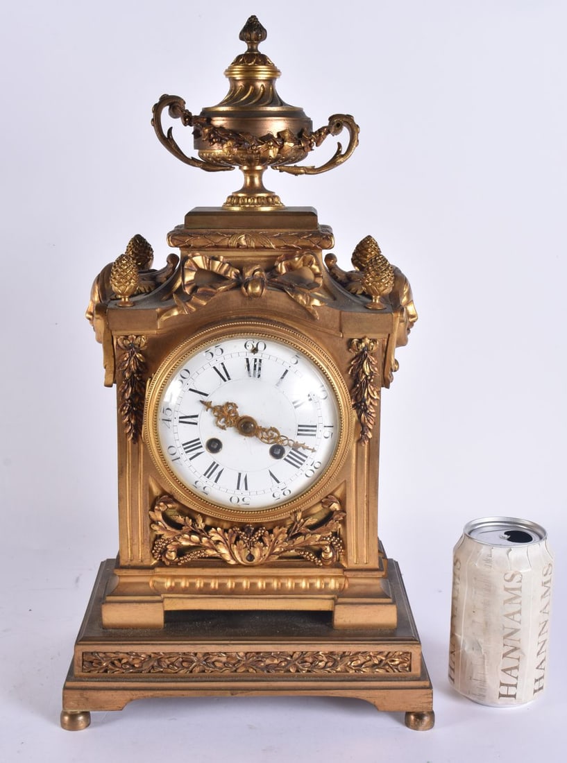 A 19TH CENTURY FRENCH BRONZE MANTEL CLOCK overlaid with swags and vines. 44 cm x 22 cm.: A 19TH CENTURY FRENCH BRONZE MANTEL CLOCK overlaid with swags and vines. 44 cm x 22 cm.