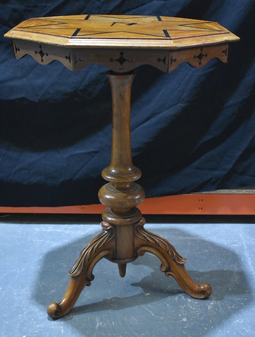 AN ISLE OF MAN MANX TABLE upon floral overlaid feet. 70 cm x 50 cm when not raised. (1 of 5)