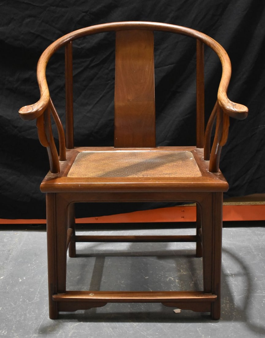 A CHINESE QING DYNASTY CARVED HUANGHUALI WOOD CHAIR with rattan seat. 94 cm x 60 cm x 44 cm. (1 of 8)