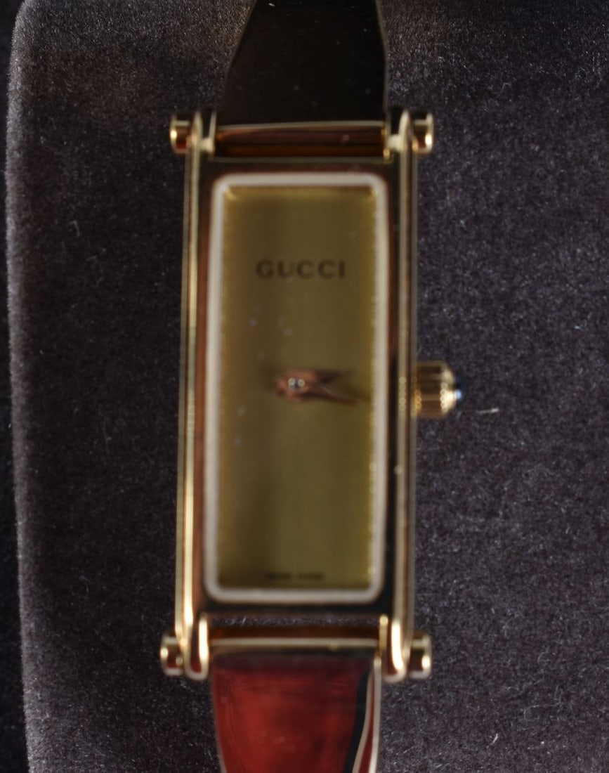 A BOXED GUCCI WRISTWATCH. Untested. 3.5 cm x 1.5 cm. (1 of 5)