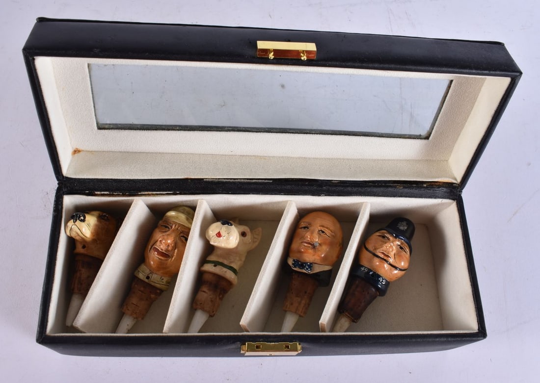 AN UNUSUAL SET OF NOVELTY BOTTLE POURERS including Winston Churchill. 9.25 cm long. (5): AN UNUSUAL SET OF NOVELTY BOTTLE POURERS including Winston Churchill. 9.25 cm long. (5)