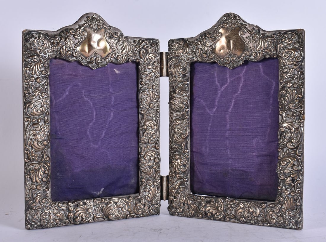 A VICTORIAN SILVER FOLDING DOUBLE PHOTOGRAPH FRAME. 22 cm x 28 cm extended.: A VICTORIAN SILVER FOLDING DOUBLE PHOTOGRAPH FRAME. 22 cm x 28 cm extended.