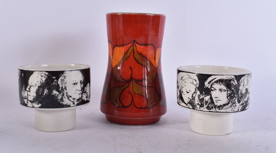 A PAIR OF D'ARTE EVA SUD CERAMIC CANDLE HOLDERS together with a Poole vase. Largest 16 cm high. (3): A PAIR OF D'ARTE EVA SUD CERAMIC CANDLE HOLDERS together with a Poole vase. Largest 16 cm high. (3)