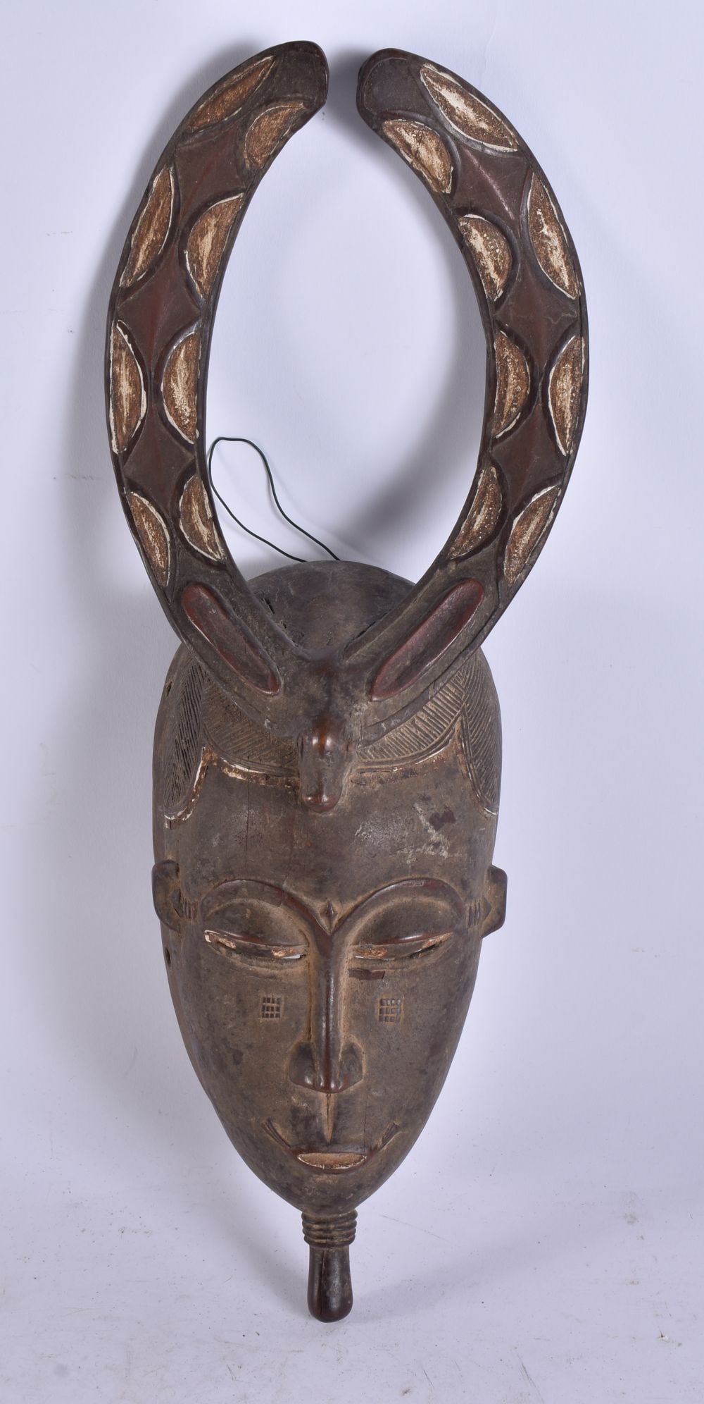 AN AFRICAN TRIBAL WOOD BAULE MASK. 38 cm x 10 cm. (1 of 4)