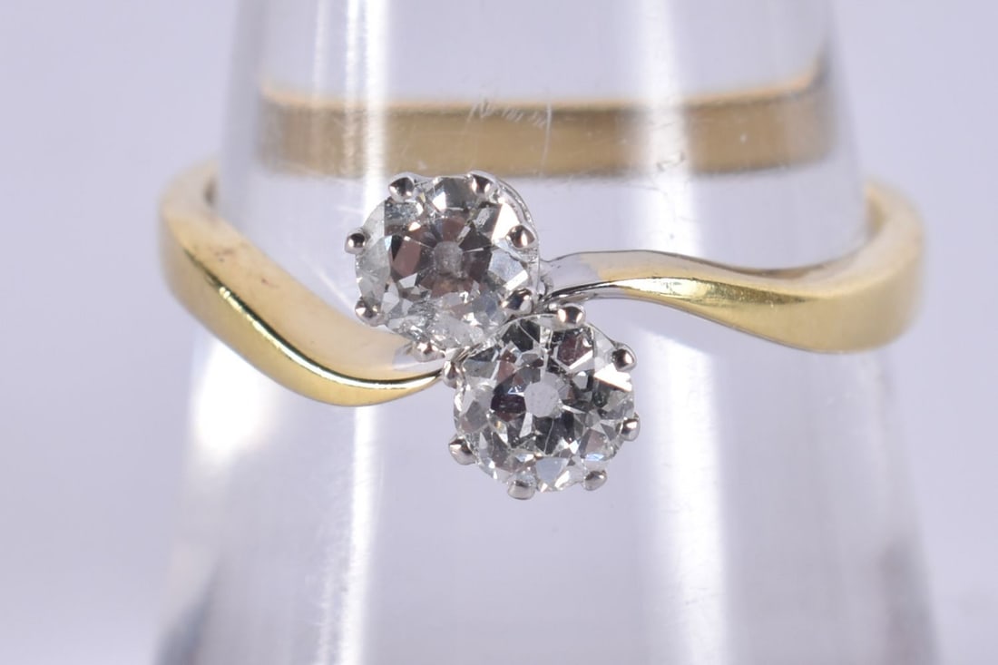 An 18ct gold two stone diamond crossover ring, maker AJW, London 1991, claw set with old-cut diamond (1 of 4)