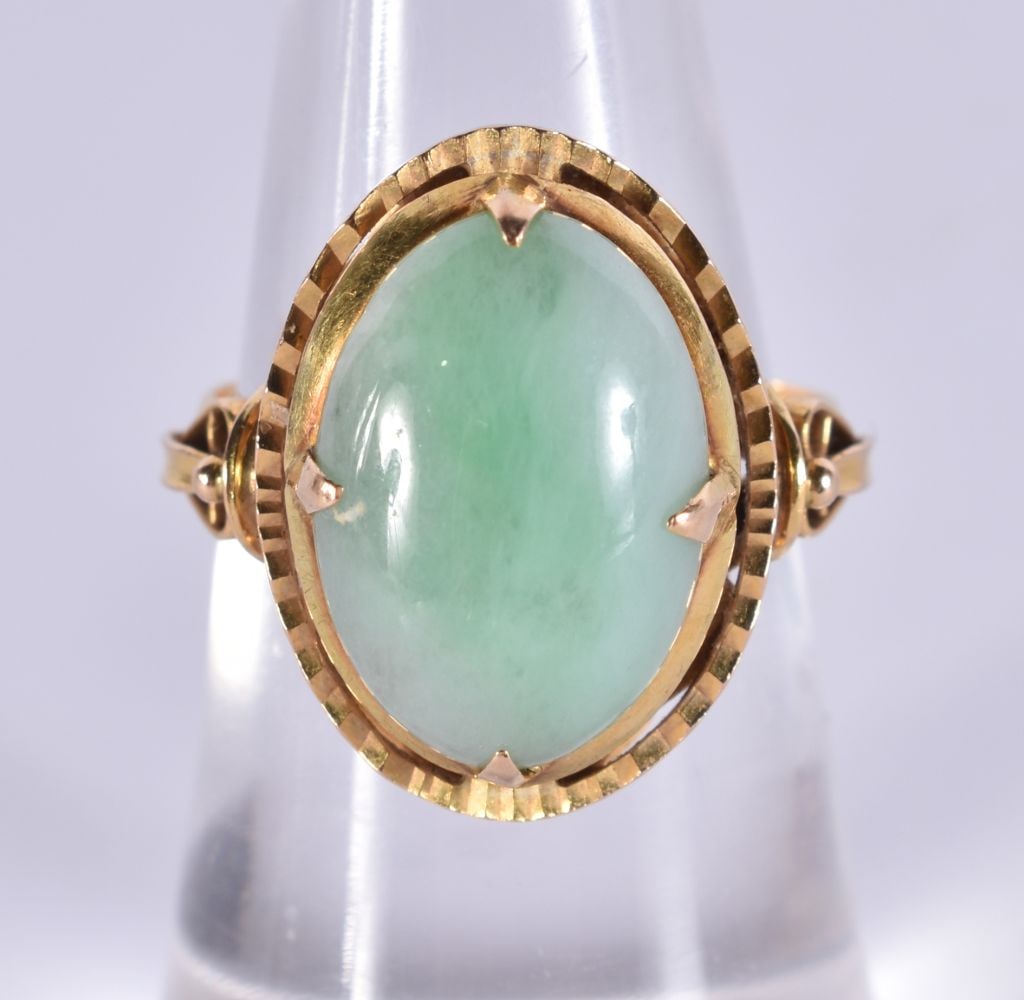 A Chinese 18ct gold jade panel ring, set with oval cabochon jade measuring 14.8 x 10.3 x 4.4mm, unma (1 of 4)