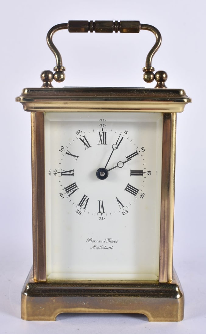 A CARRIAGE CLOCK. 14.5 cm high inc handle. (1 of 6)