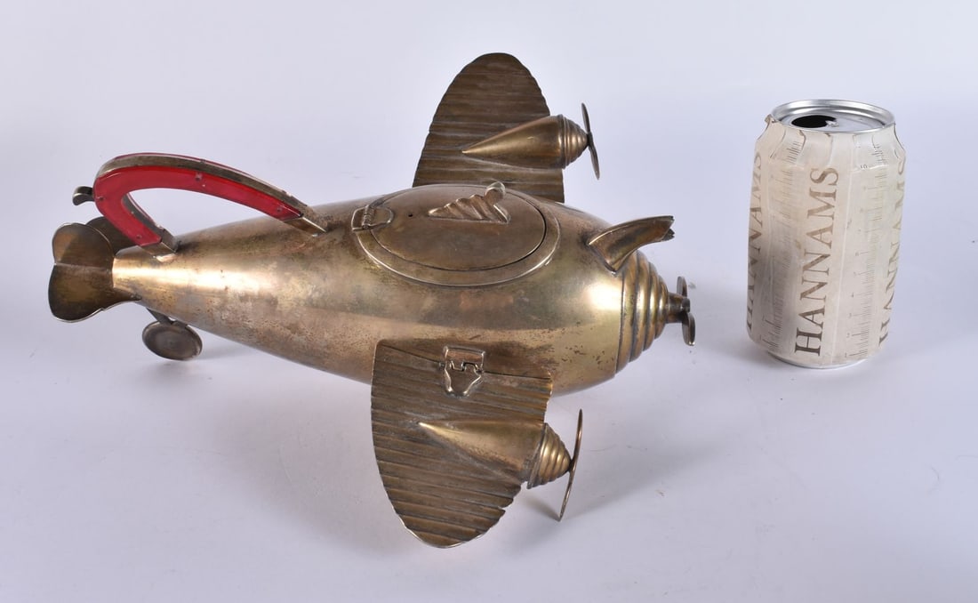 A RARE ART DECO SILVER PLATED NOVELTY AEROPLANE TEAPOT. 30 cm wide.: A RARE ART DECO SILVER PLATED NOVELTY AEROPLANE TEAPOT. 30 cm wide.