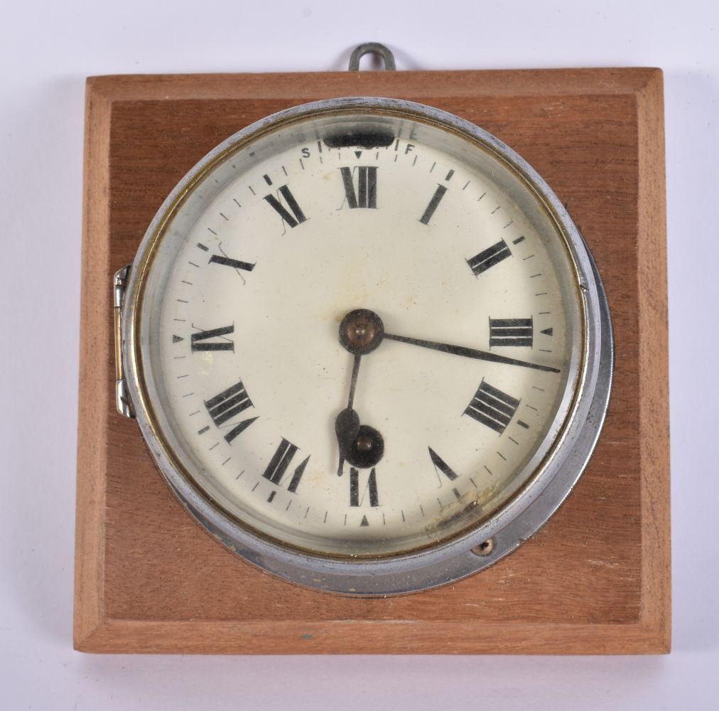 A VINTAGE CLOCK. 13 cm square.: A VINTAGE CLOCK. 13 cm square.