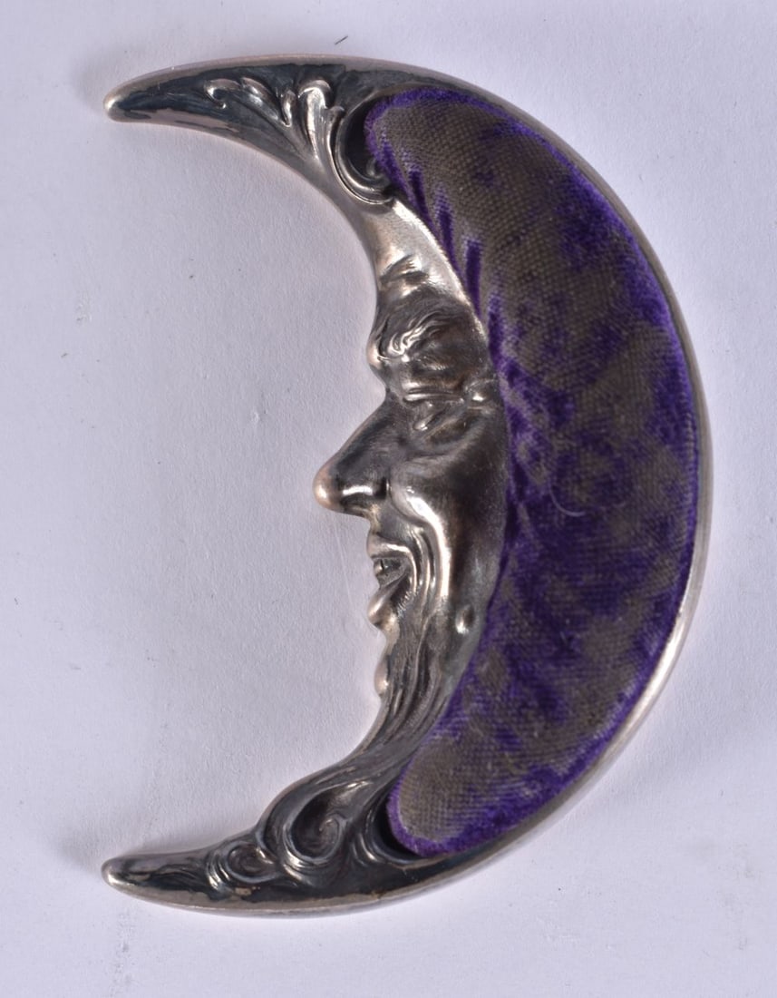 AN EARLY 20TH CENTURY STERLING SILVER MAN IN THE MOON PIN CUSHION. 28 grams. 8 cm long. (1 of 4)