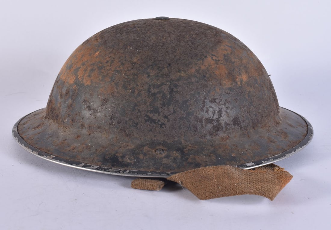 A MILITARY HELMET. 27 cm x 24 cm. (1 of 4)