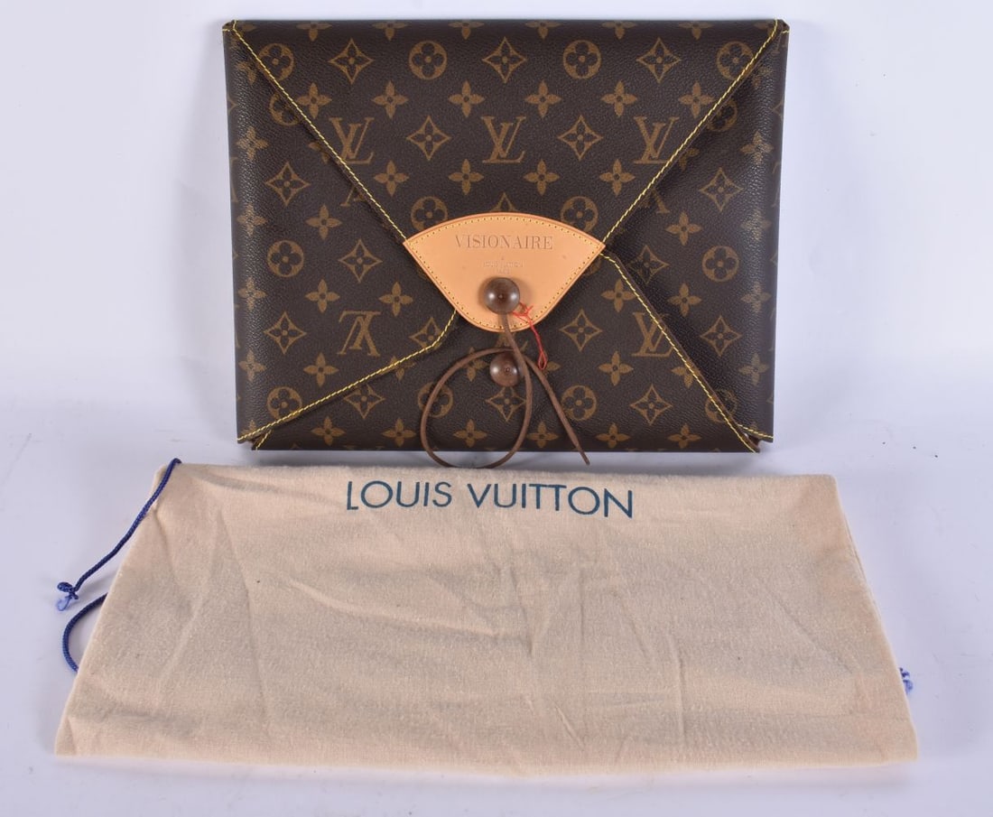 A LOUIS VUITTON LEATHER VISIONAIRE CASE containing fashion photographs. 30 cm x 23 cm.: A LOUIS VUITTON LEATHER VISIONAIRE CASE containing fashion photographs. 30 cm x 23 cm.