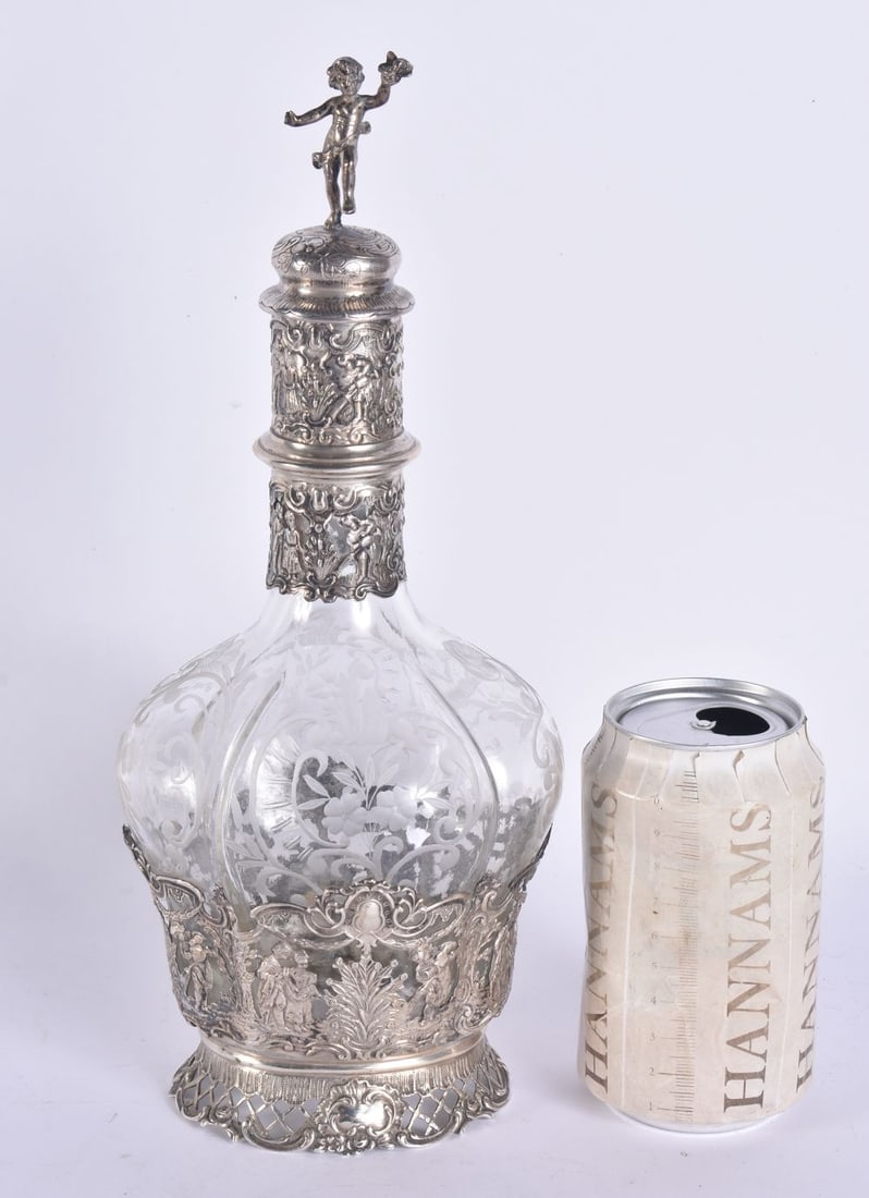 AN ANTIQUE GERMAN SILVER MOUNTED GLASS DECANTER. 28.5 cm high. (1 of 7)