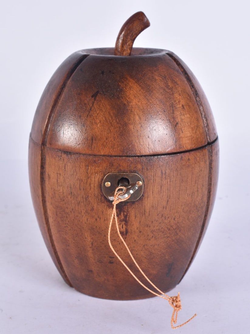A TREEN CARVED WOOD TEA CADDY. 16 cm high. (1 of 4)