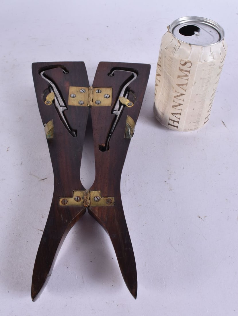 A FINE AND UNUSUAL GEORG III CARVED WOOD NOVELTY BOOT JACK formed as a pair of legs, with fitted int (1 of 3)