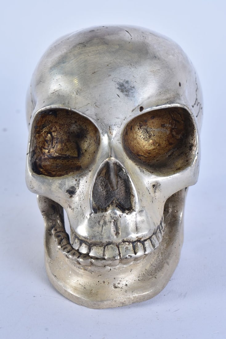A SILVER PLATED ARTICULATED SKULL. 12 cm wide. (1 of 4)
