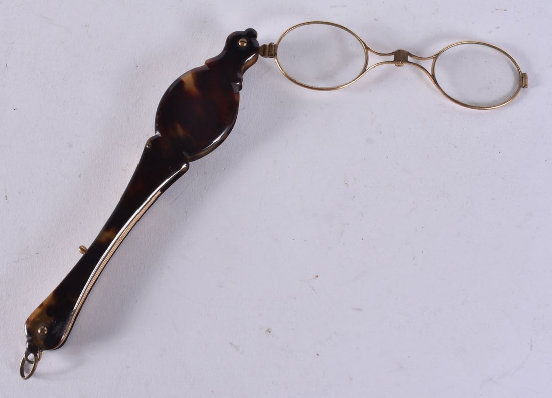A PAIR OF TORTOISESHELL LORGNETTES. 20 cm long extended. (1 of 3)