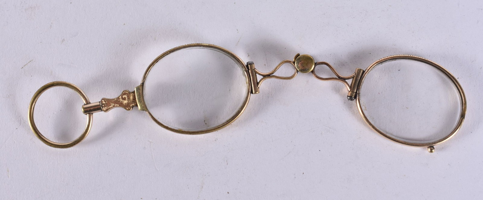 A PAIR OF YELLOW METAL LORGNETTES. 9.5 cm long. (1 of 2)