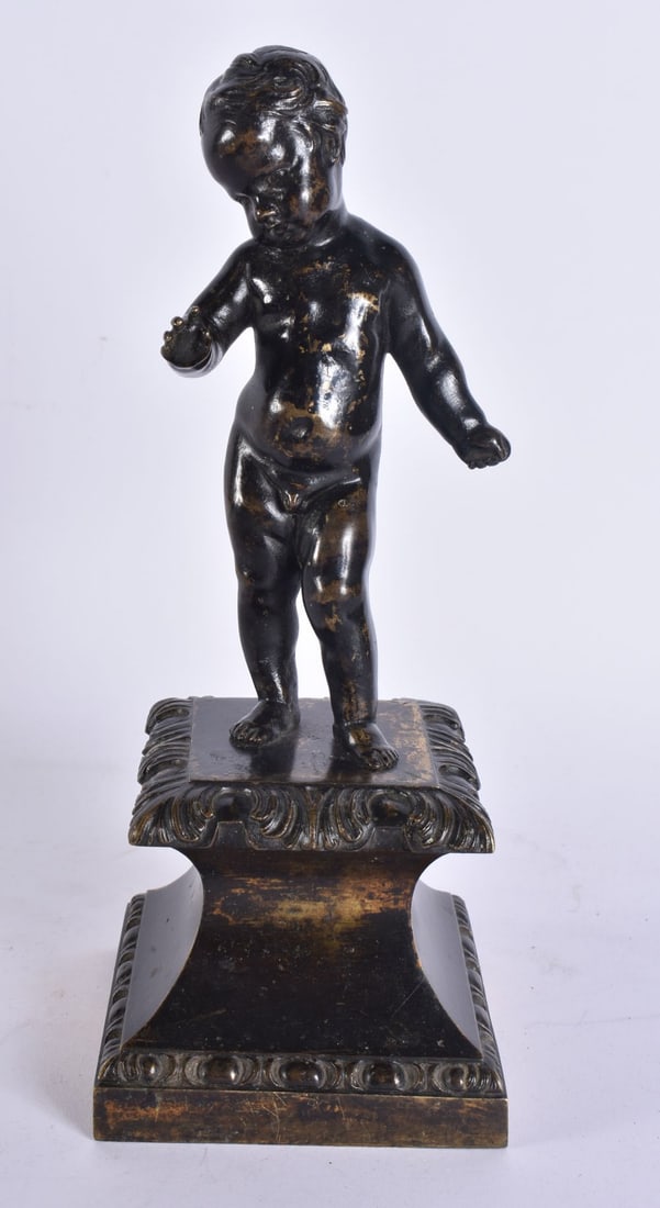 AN 18TH CENTURY EUROPEAN BRONZE FIGURE OF A PUTTI modelled holding a rococo base. 24.5 cm high. (1 of 5)