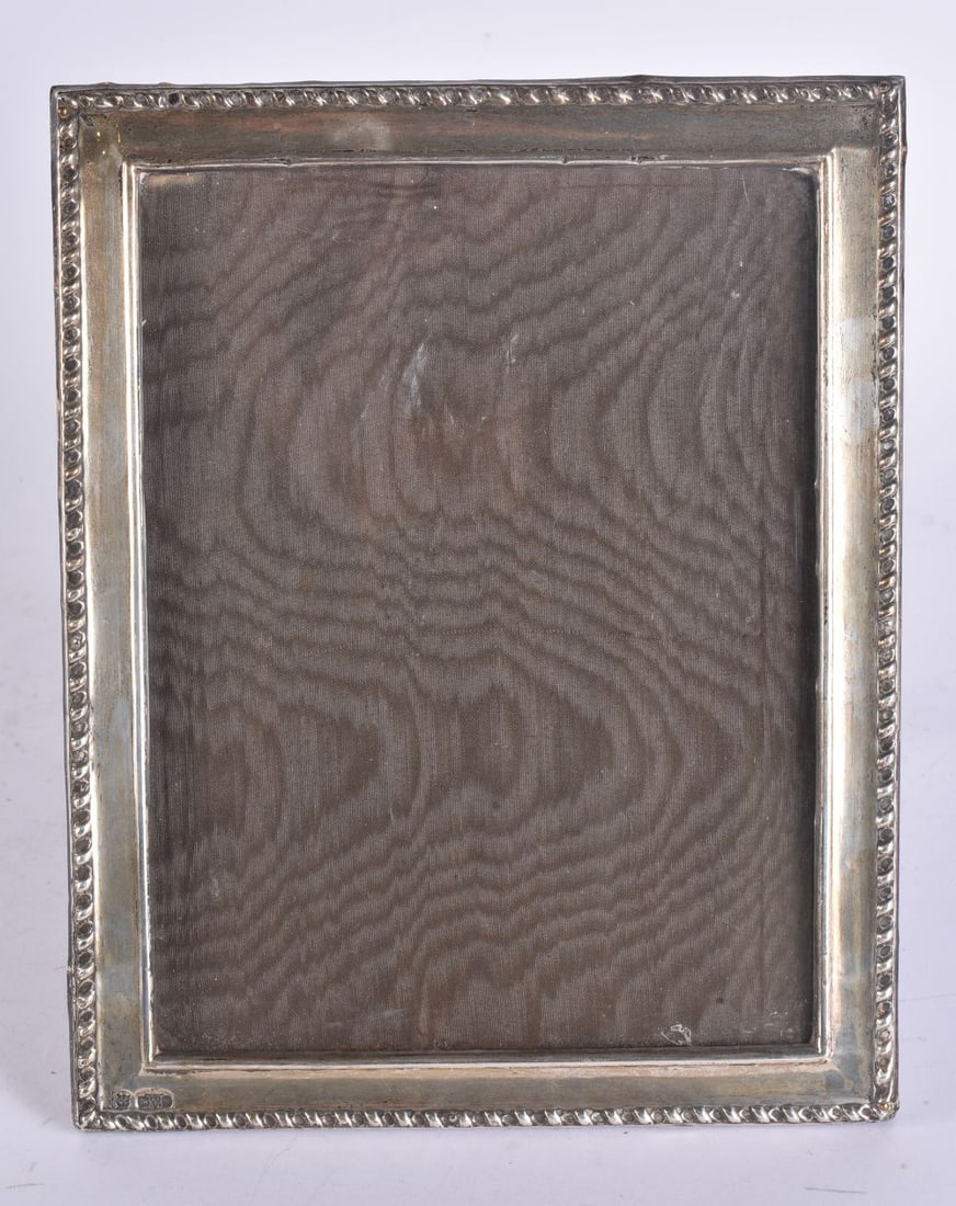 A SILVER PHOTOGRAPH FRAME. 24 cm x 20 cm. (1 of 3)