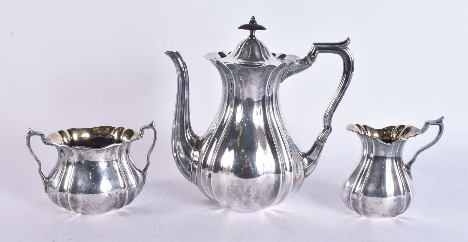 A SILVER THREE PIECE TEASET. 894 grams. Largest 25 cm x 15 cm. (1 of 6)