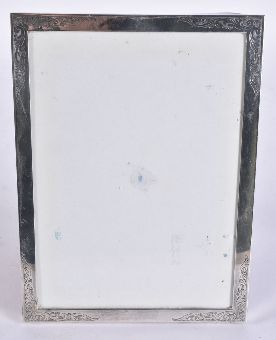 A SILVER PHOTOGRAPH FRAME. 324 grams overall. 20 cm x 15 cm. (1 of 3)