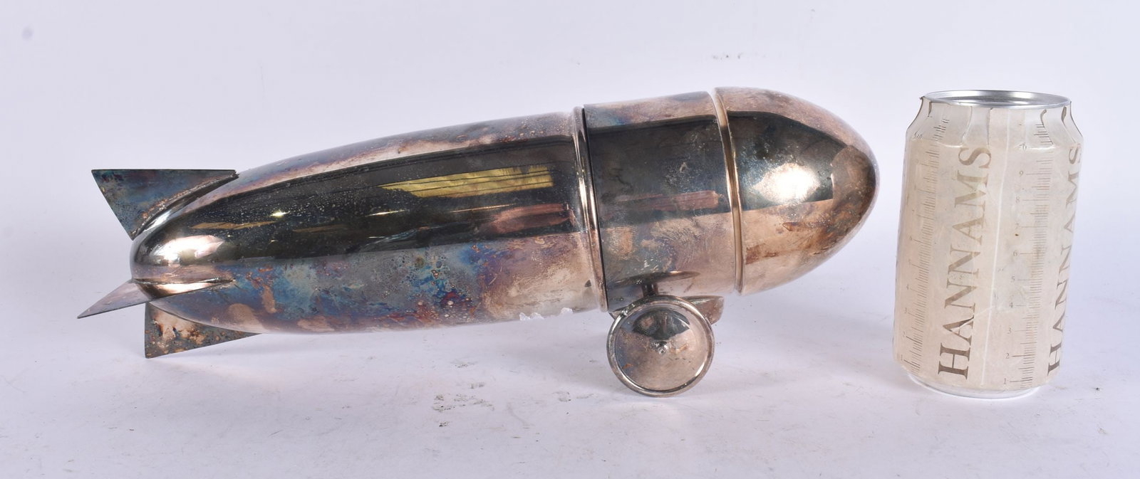 A SILVER PLATED ZEPPELIN COCKTAIL SHAKER. 33 cm long. (1 of 4)