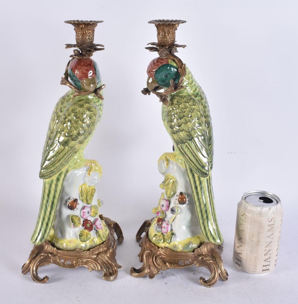 A LARGE PARROT BRONZE AND POTTERY CANDLESTICKS. 37 cm high.: A LARGE PARROT BRONZE AND POTTERY CANDLESTICKS. 37 cm high.