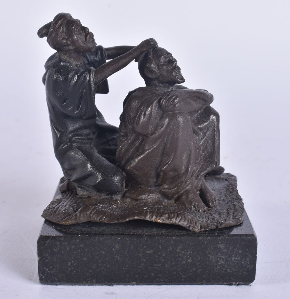 A BRONZE ARABIC GROUP. 10 cm x 8 cm. (1 of 5)