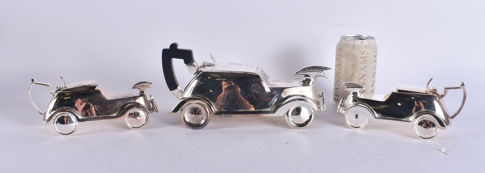 A NOVELTY SILVER PLATED AUTOMOTIVE CAR TEASET. Largest 23 cm wide. (3) (1 of 6)