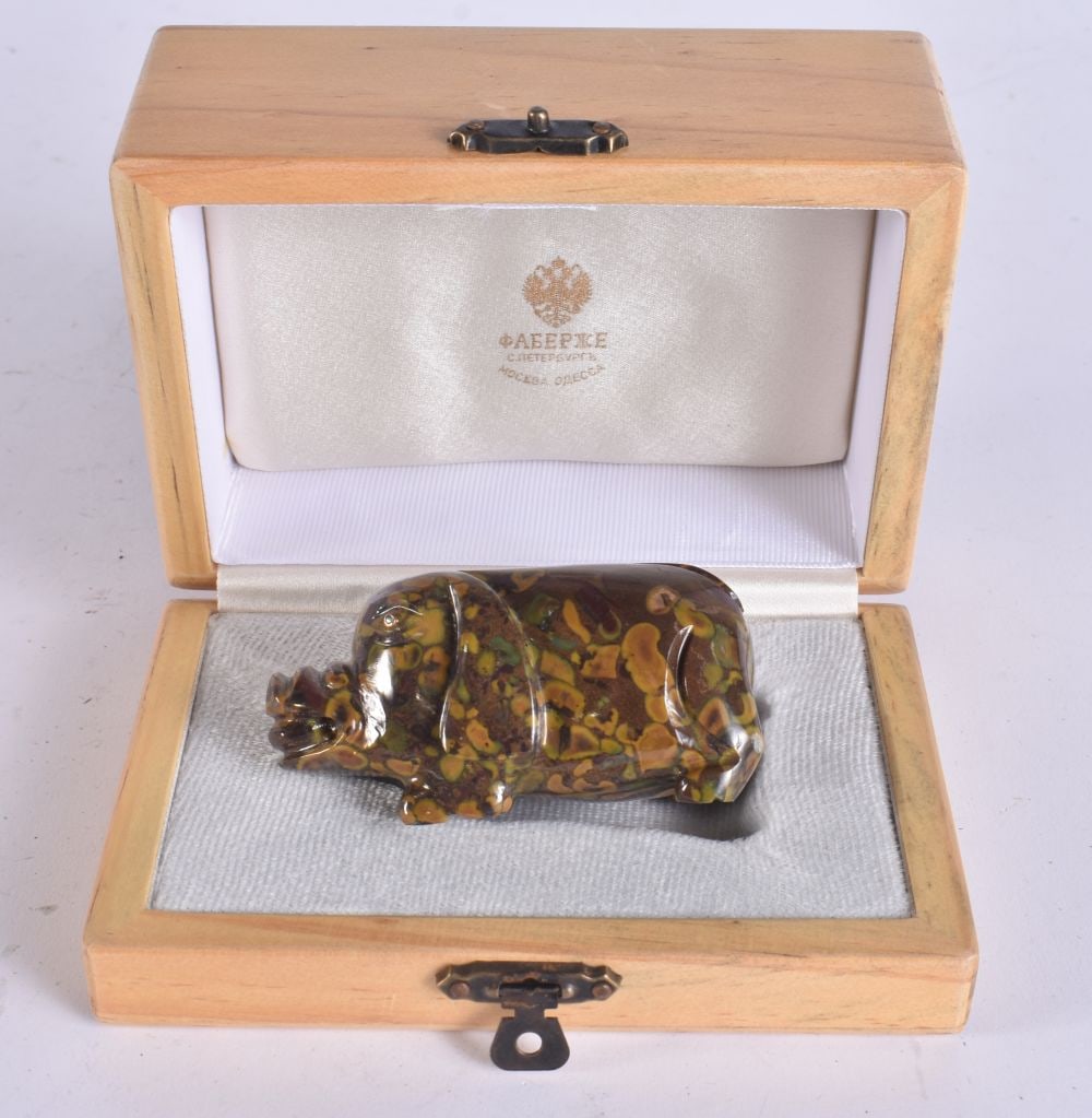 A GOLD MOUNTED BLOODSTONE PIG with emerald eyes. 8 cm x 3 cm. (1 of 5)