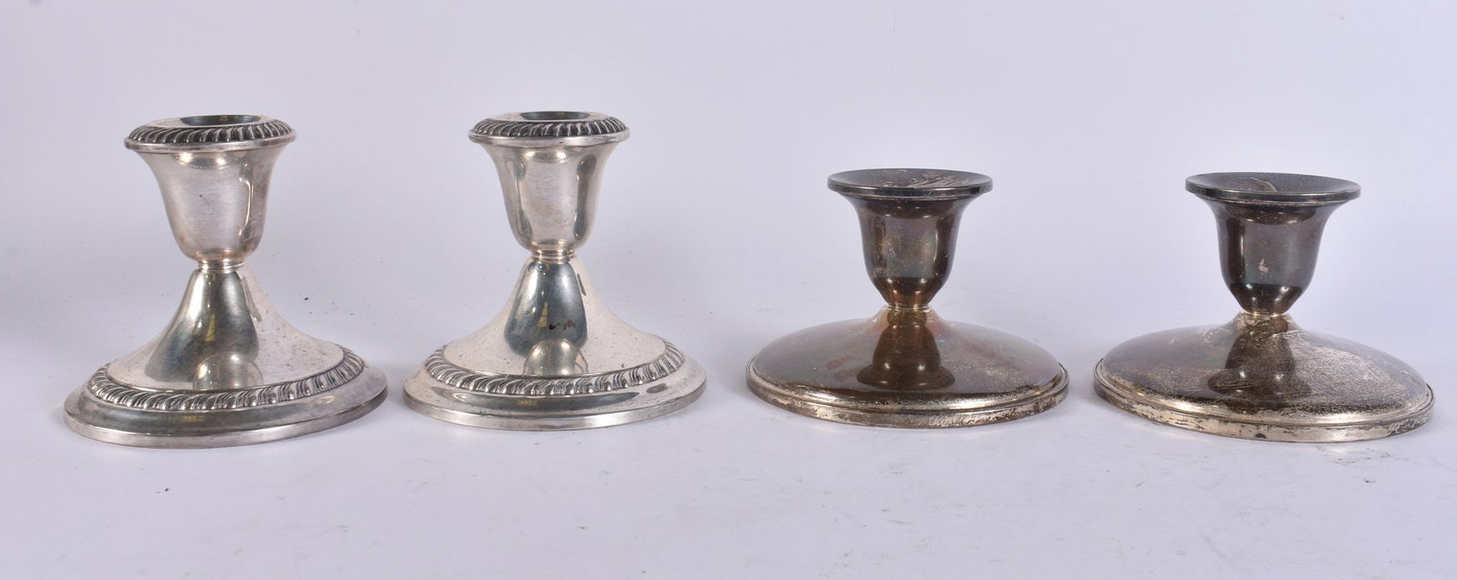 TWO PAIRS OF SILVER CANDLESTICKS. 1240 grams overall. 9.5 cm wide. (4) (1 of 6)